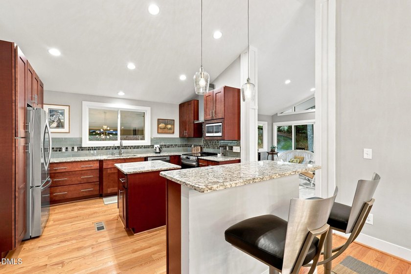 Set on two lots totaling 1.3 acres with panoramic views of the - photo 16