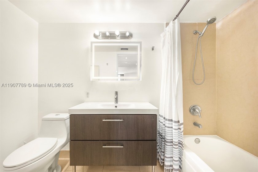 Sleek city living meets unmatched convenience in this updated - photo 4
