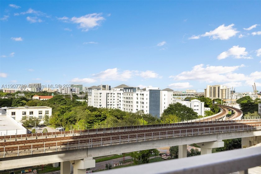 Sleek city living meets unmatched convenience in this updated - photo 7