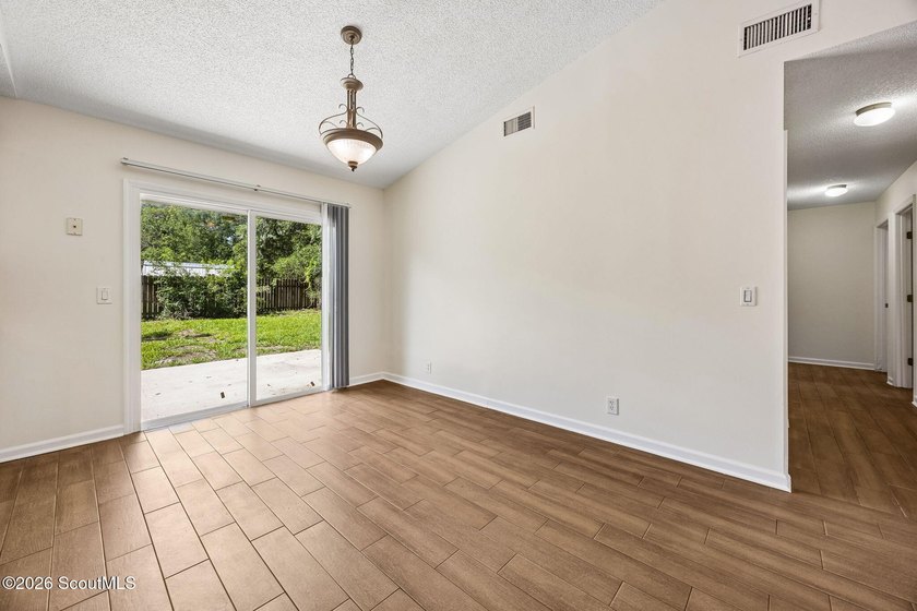 Ready for a quick move-in! This home offers tiled flooring - photo 13