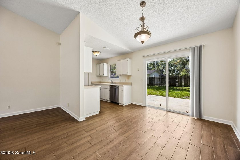 Ready for a quick move-in! This home offers tiled flooring - photo 14