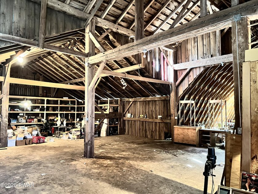 This property features a well-maintained barn roughly 12,000 sq - photo 11