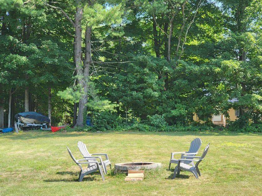Located within walking distance of Schroon Lake village and the - photo 3
