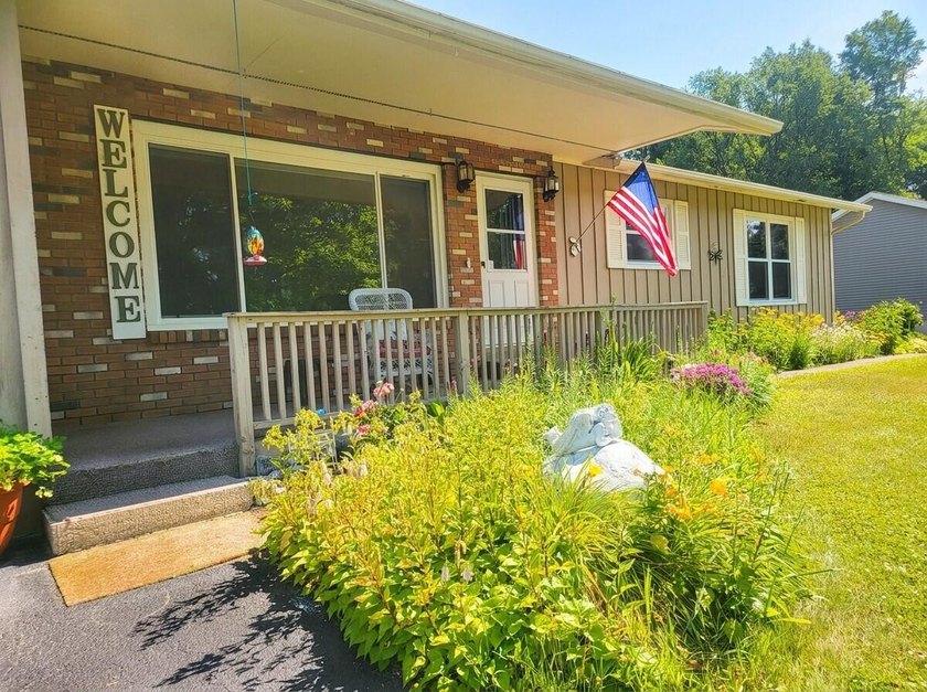 Located within walking distance of Schroon Lake village and the - photo 5
