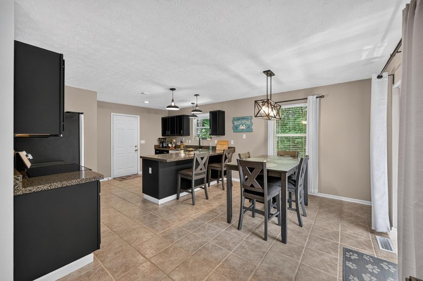 This 3-bedroom ranch offers a spacious, functional layout with a - photo 10