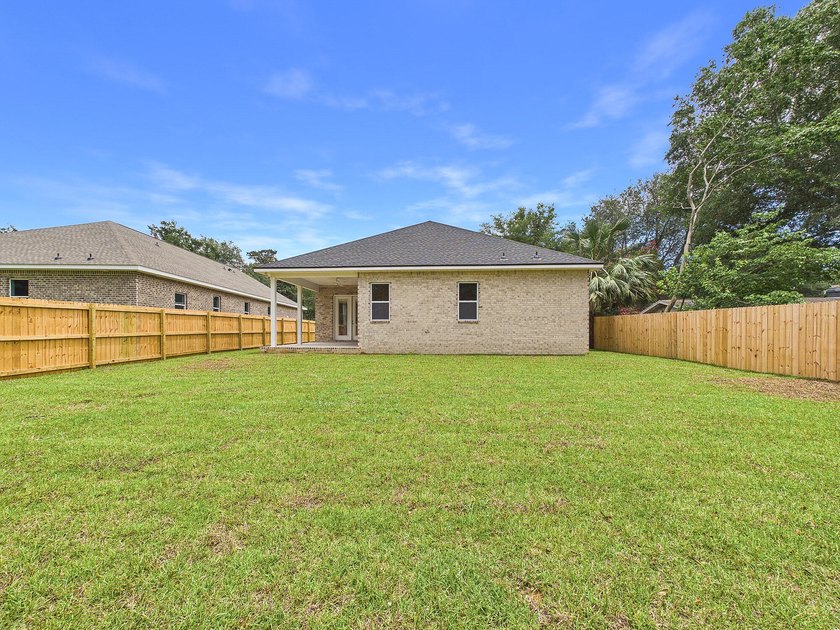 This spacious single-story residence offers a seamless blend of - photo 2