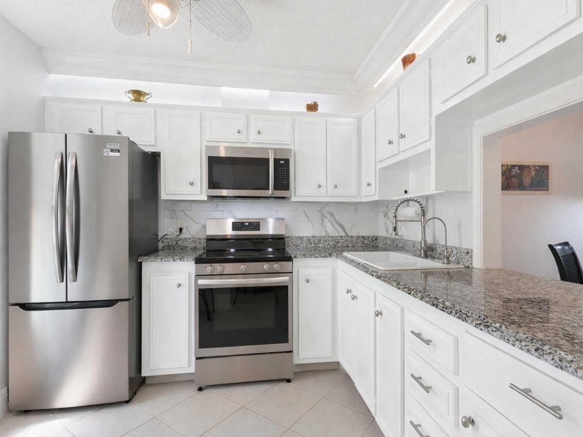 Enjoy easy Florida living in this beautifully maintained and - photo 7