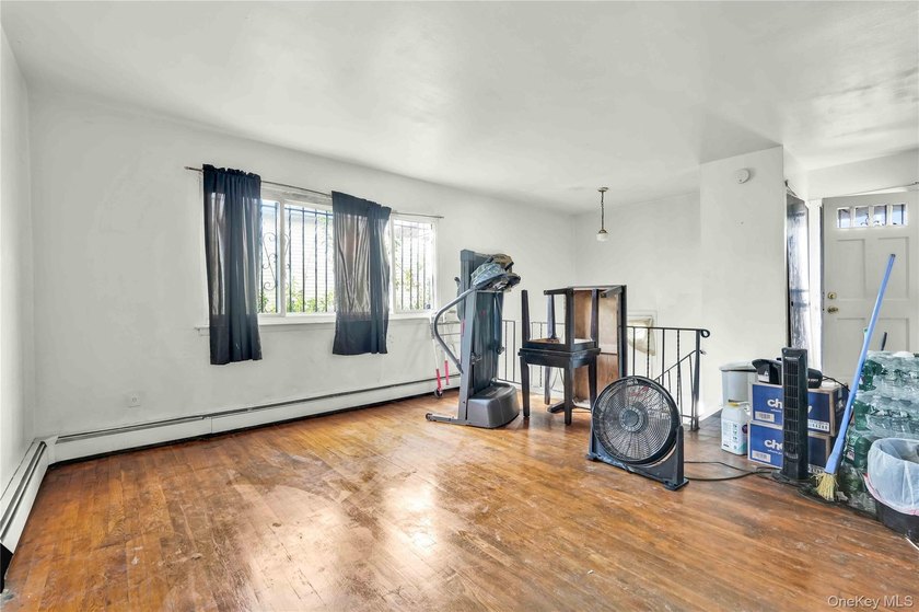 Welcome to 115-36 157th Street, a spacious two-family home in - photo 8