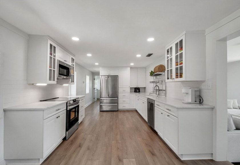 This Lake Home is truly a rare gem! Nestled along 165 Feet of - photo 17