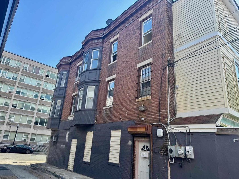 This is a triplex with a lot of potential. The building has 2 - photo 2