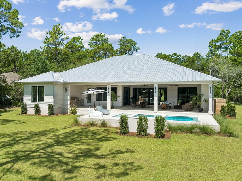 Welcome home to waterfront living on Eden Drive. This brand new - photo 2
