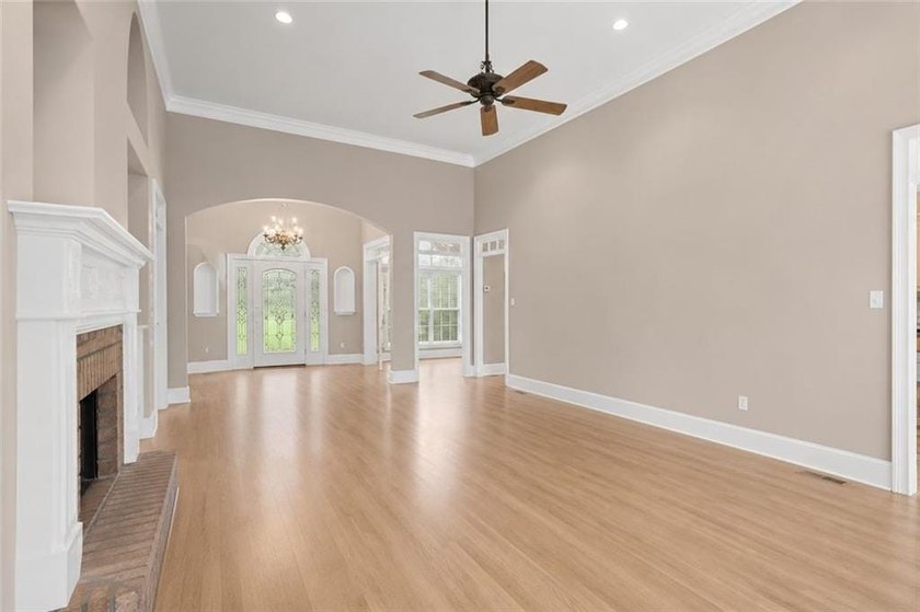 This exquisite four-sided blush brick estate is the epitome of - photo 12