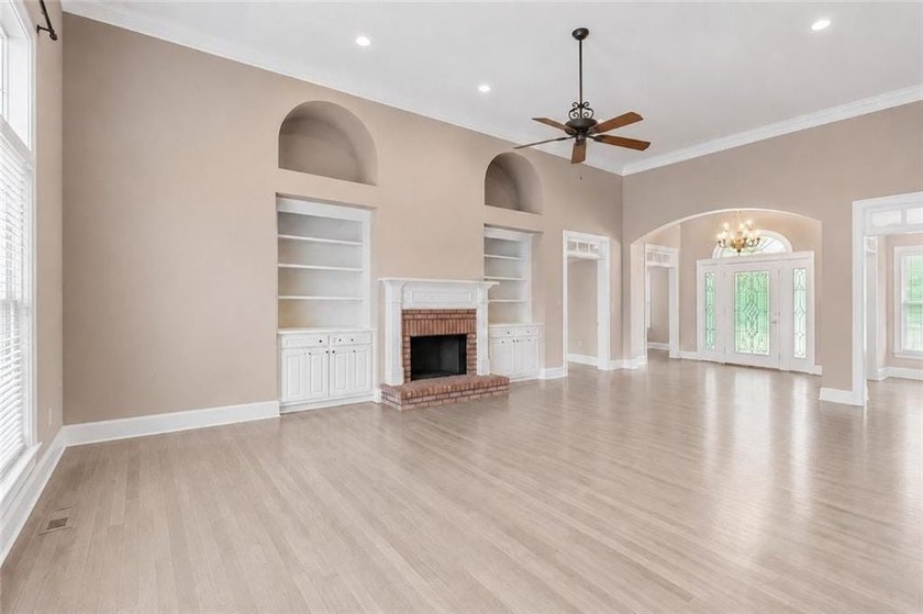 This exquisite four-sided blush brick estate is the epitome of - photo 13