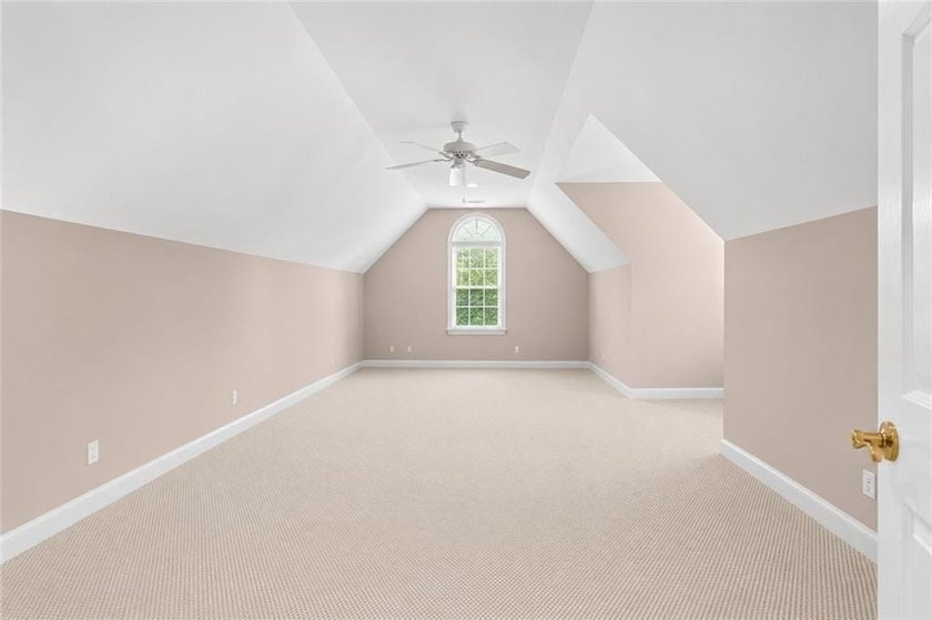 This exquisite four-sided blush brick estate is the epitome of - photo 33