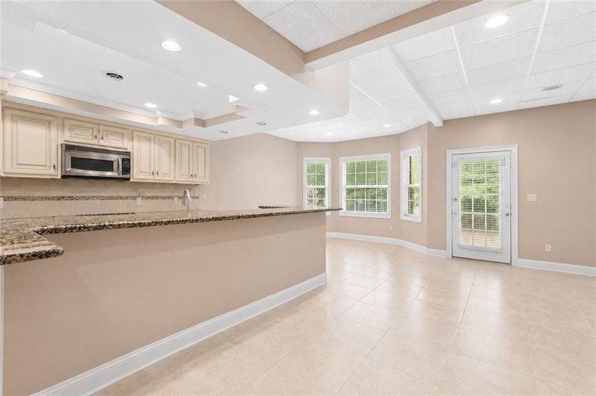 This exquisite four-sided blush brick estate is the epitome of - photo 40