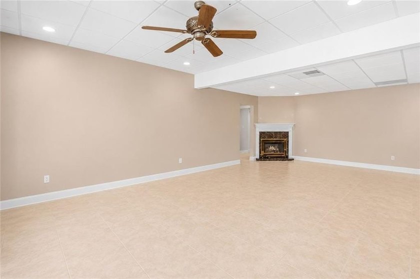 This exquisite four-sided blush brick estate is the epitome of - photo 44