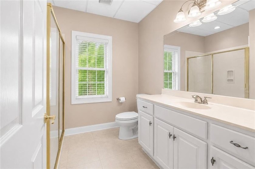 This exquisite four-sided blush brick estate is the epitome of - photo 46