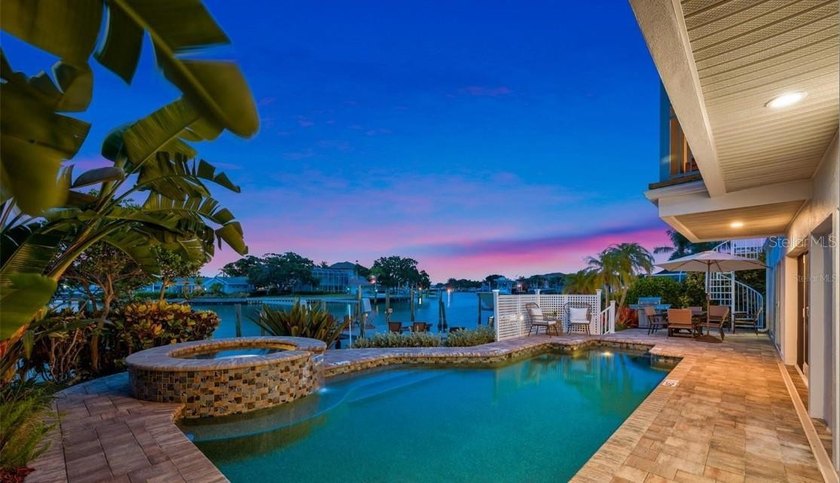 Perfectly positioned within the exclusive waterfront enclave of - photo 2