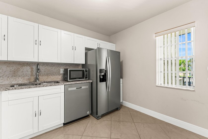 Beautifully renovated 2nd-floor corner unit in the highly - photo 9