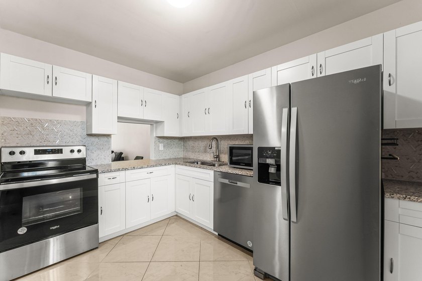 Beautifully renovated 2nd-floor corner unit in the highly - photo 10