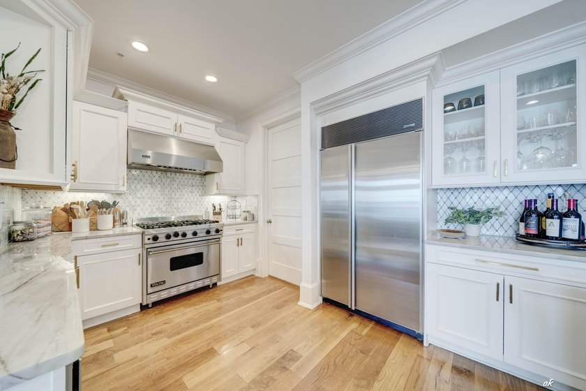 This extraordinary waterfront end unit condo, nestled in the - photo 7