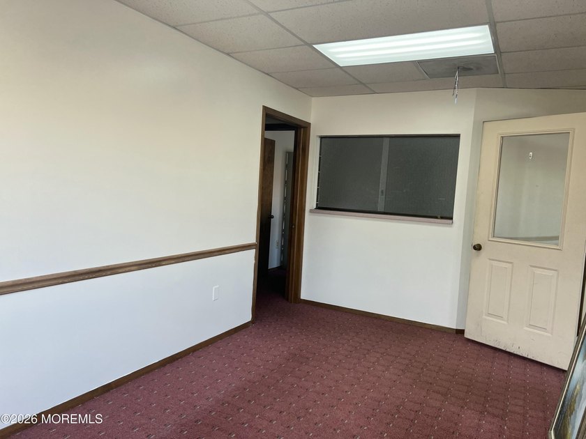 Available a one-story end unit office condo. The unit features - photo 2