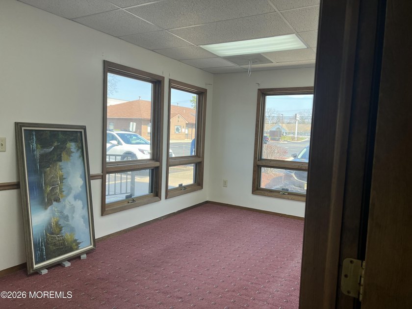 Available a one-story end unit office condo. The unit features - photo 3