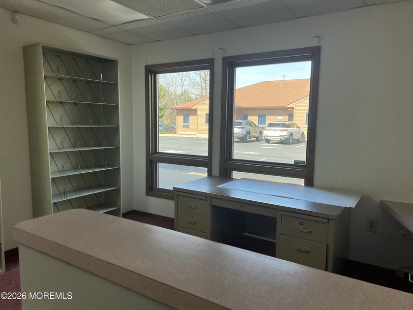 Available a one-story end unit office condo. The unit features - photo 4