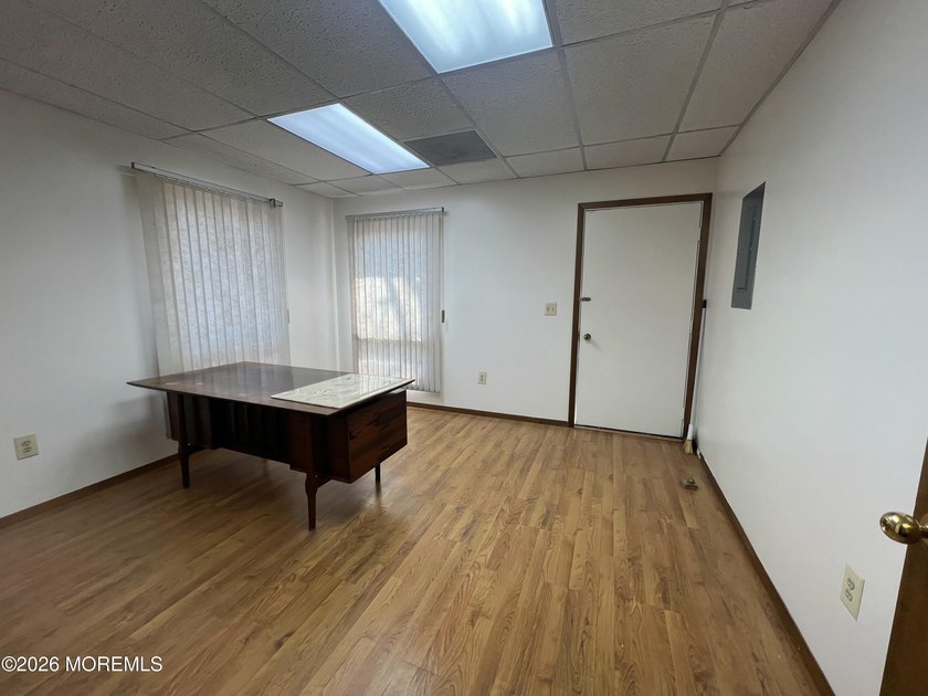 Available a one-story end unit office condo. The unit features - photo 6