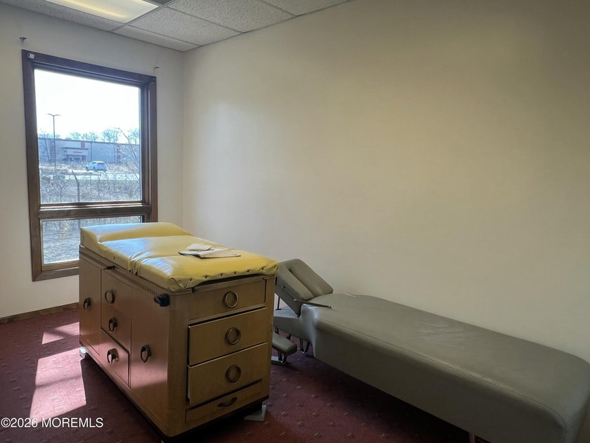 Available a one-story end unit office condo. The unit features - photo 7