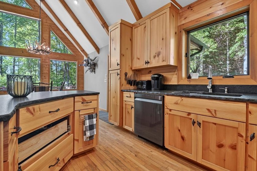 Tucked beneath a canopy of towering hardwoods and surrounded by - photo 13