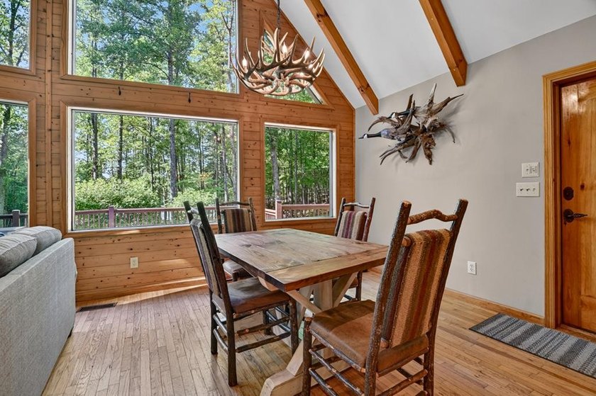 Tucked beneath a canopy of towering hardwoods and surrounded by - photo 14