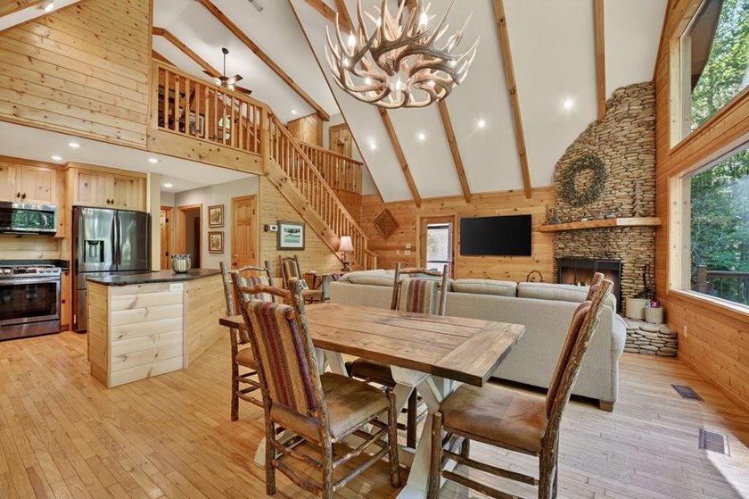 Tucked beneath a canopy of towering hardwoods and surrounded by - photo 15