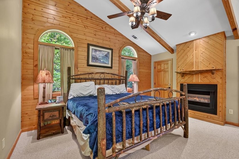 Tucked beneath a canopy of towering hardwoods and surrounded by - photo 20