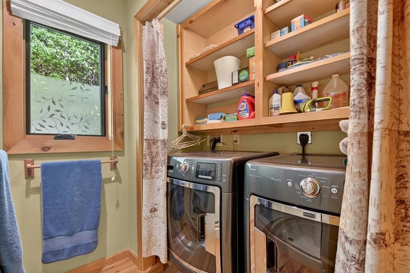 Tucked beneath a canopy of towering hardwoods and surrounded by - photo 22