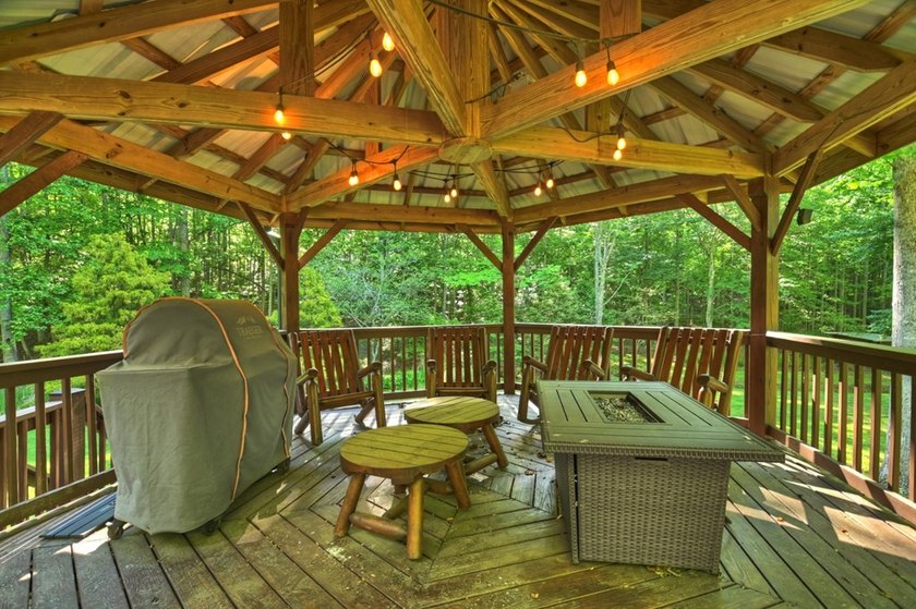 Tucked beneath a canopy of towering hardwoods and surrounded by - photo 23