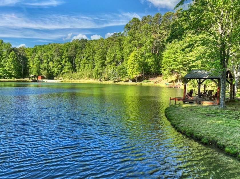 Tucked beneath a canopy of towering hardwoods and surrounded by - photo 27