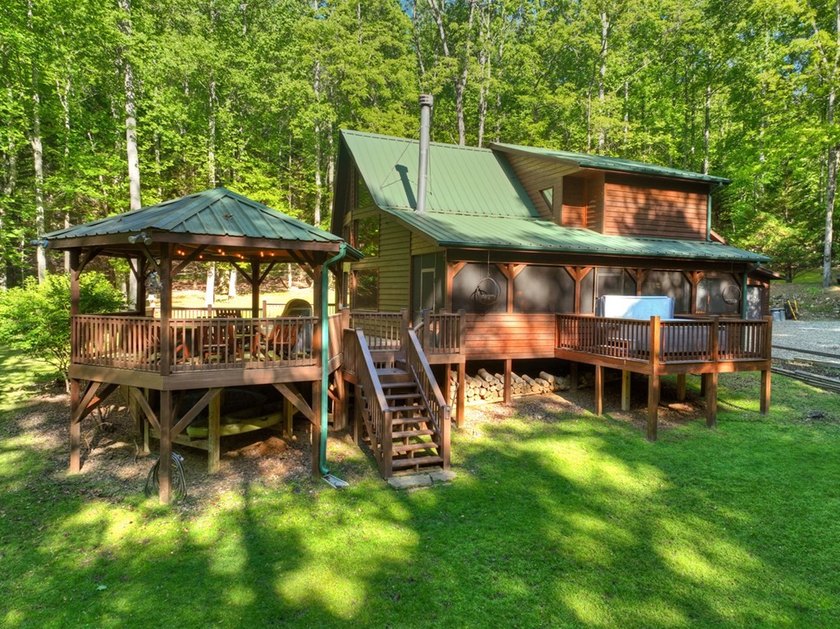 Tucked beneath a canopy of towering hardwoods and surrounded by - photo 28