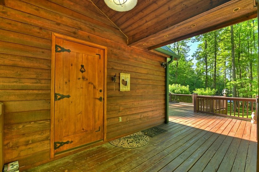 Tucked beneath a canopy of towering hardwoods and surrounded by - photo 32