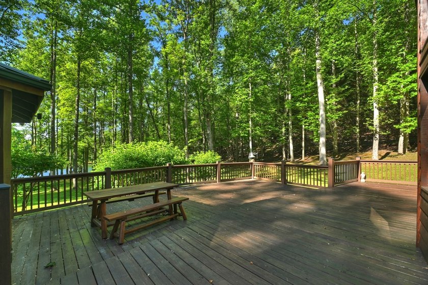 Tucked beneath a canopy of towering hardwoods and surrounded by - photo 35