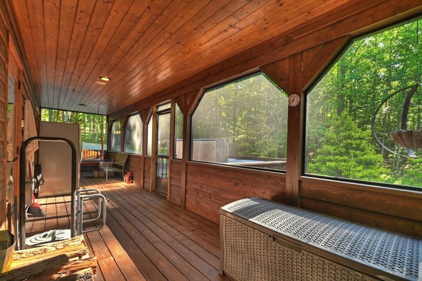 Tucked beneath a canopy of towering hardwoods and surrounded by - photo 36