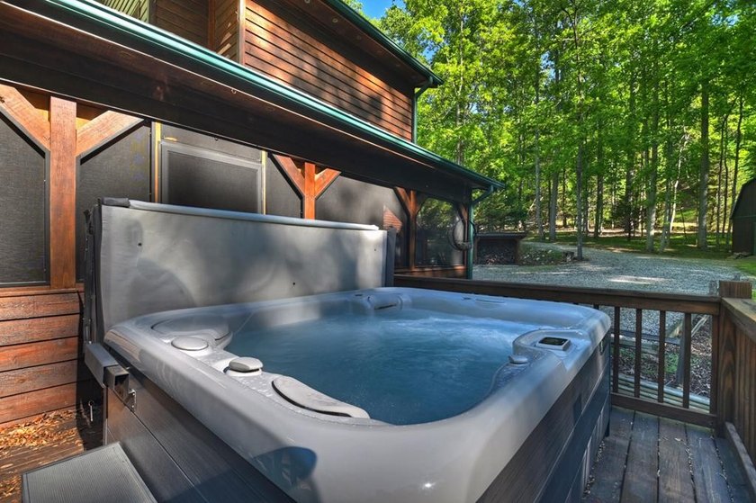 Tucked beneath a canopy of towering hardwoods and surrounded by - photo 37