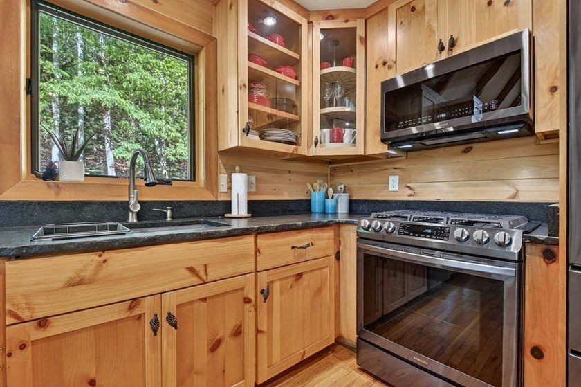 Tucked beneath a canopy of towering hardwoods and surrounded by - photo 42