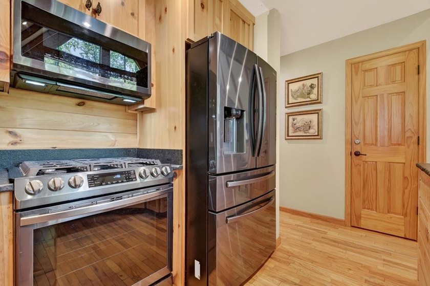 Tucked beneath a canopy of towering hardwoods and surrounded by - photo 43