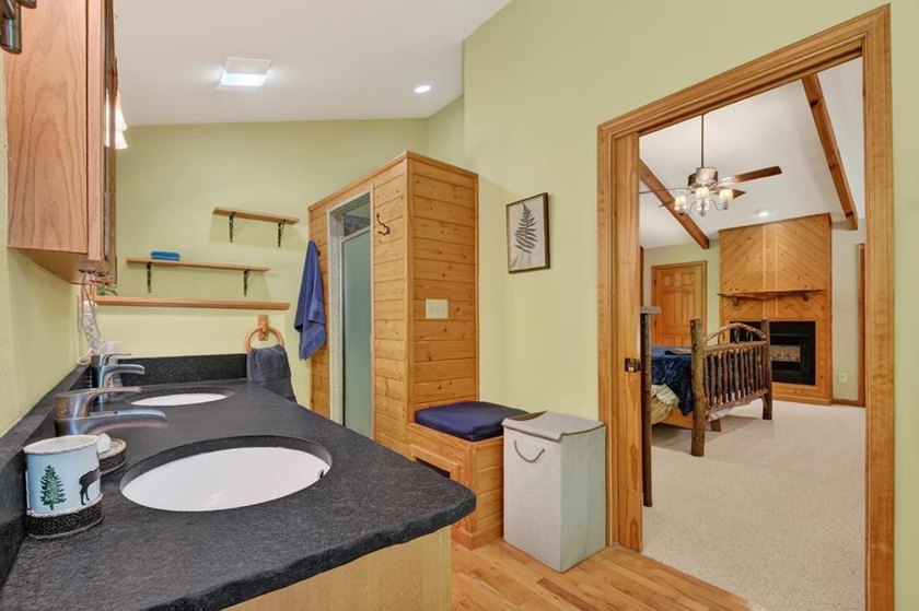 Tucked beneath a canopy of towering hardwoods and surrounded by - photo 45