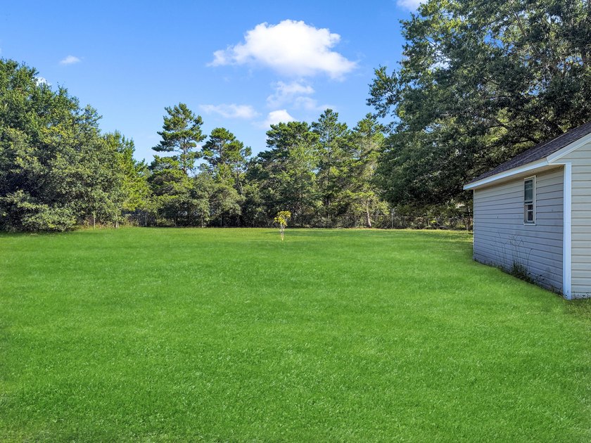 This 3 BR 2 BA home is located on one of the highest lots in the - photo 4
