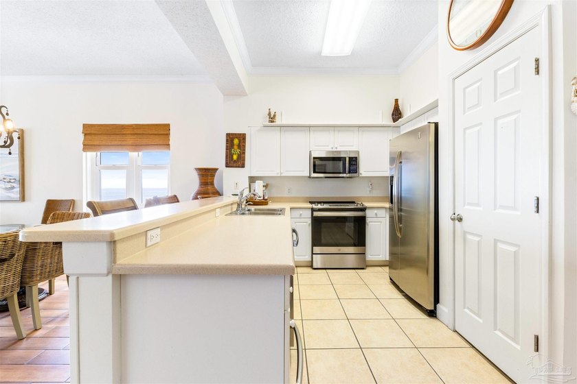 EXPERIENCE TRUE PERDIDO KEY LIFE FROM THIS 4-BEDROOM WEST-CORNER - photo 11