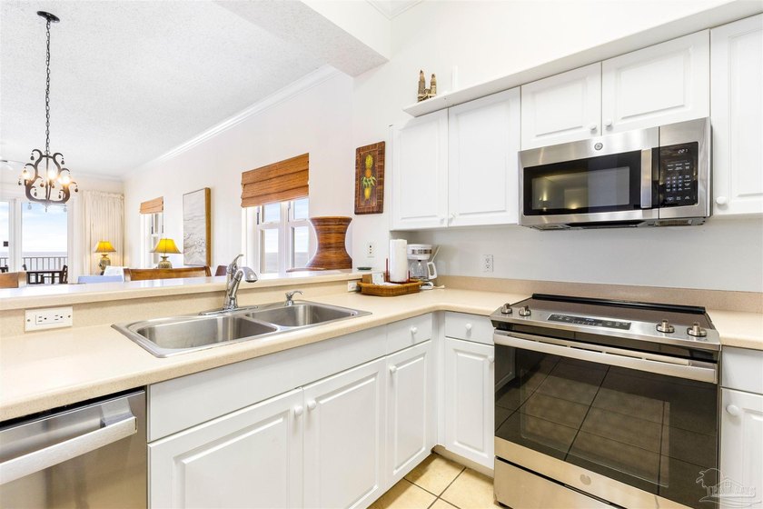 EXPERIENCE TRUE PERDIDO KEY LIFE FROM THIS 4-BEDROOM WEST-CORNER - photo 12