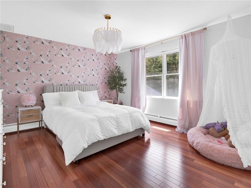 A circular driveway welcomes you to this elegant Colonial set on - photo 32