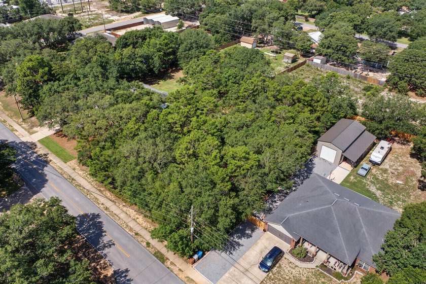 Build your dream home on this oversized vacant lot. Located just - photo 2